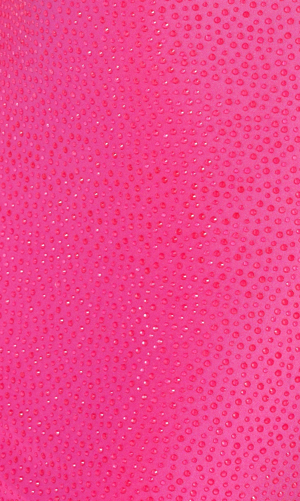 Close-up of a pink textured surface with shiny, evenly spaced dots—echoing the elegant shimmer on the Strappy-Back Long Beaded Ellie Wilde Formal Gown.